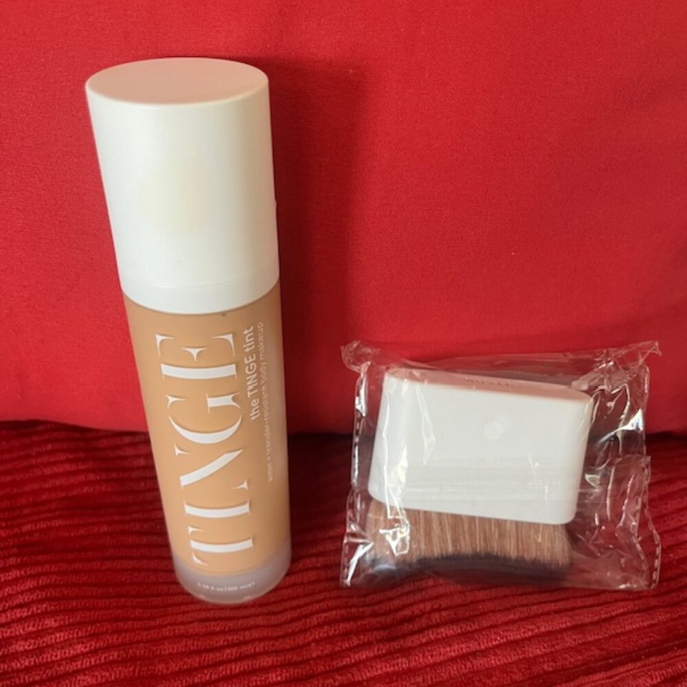 The Tinge beauty tint water + transfer resistant body makeup in Tan/Warm & brush